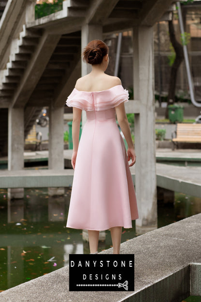 Woman in a pink off-shoulder dress with four layers of satin and silk chiffon