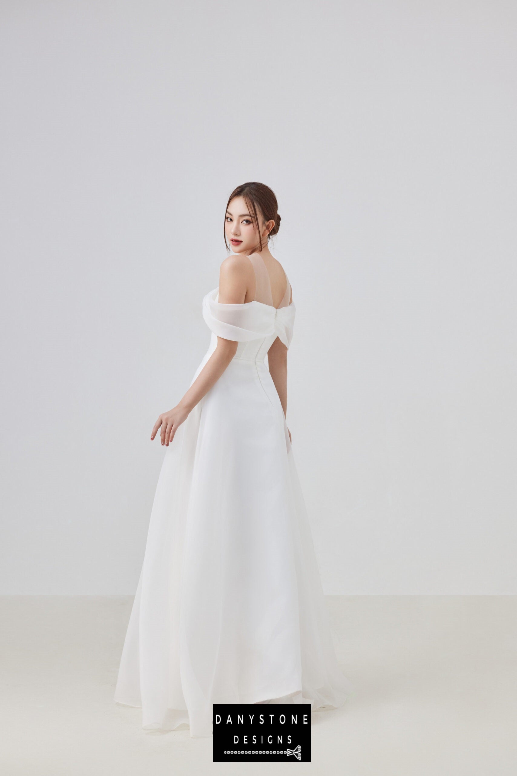 Bridal gown with classic off-the-shoulder neckline and satin bow, Angel Whisper Chiffon Dress by Danystone Designs