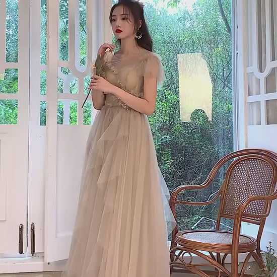 Model wearing romantic tulle formal gown