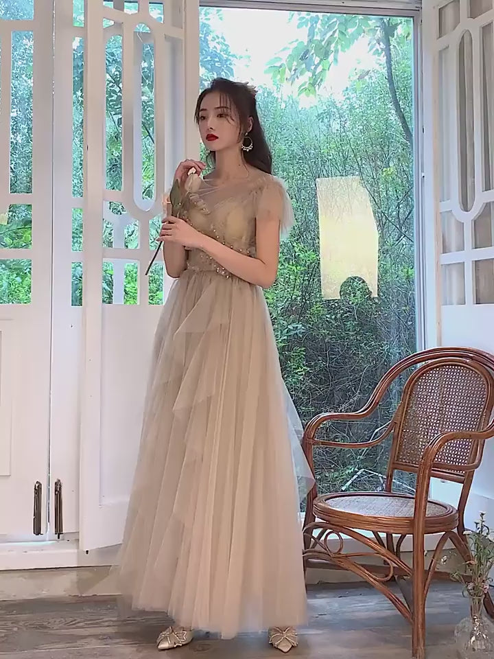 Model wearing romantic tulle formal gown