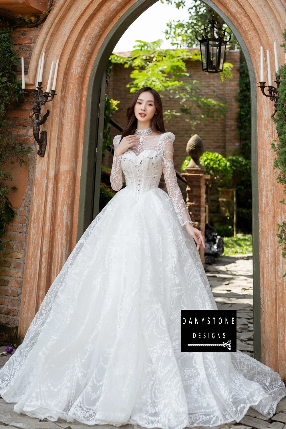 "Bride in Royal Floral Lace Wedding Dress standing in archway"